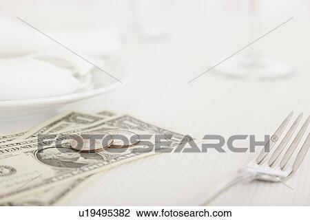 Stock Image - USA, Illinois, Metamora, Tip on restaurant table. Fotosearch