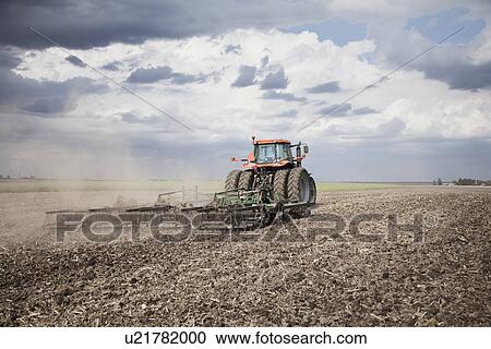USA, Illinois, Metamora, tractor plowing field View Large Photo Image Stock Image - USA, Illinois, Metamora, tractor plowing field. Fotosearch