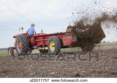 USA, Illinois, Metamora, tractor working on field View Large Photo Image Stock Photo - USA, Illinois, Metamora, tractor working on field. Fotosearch