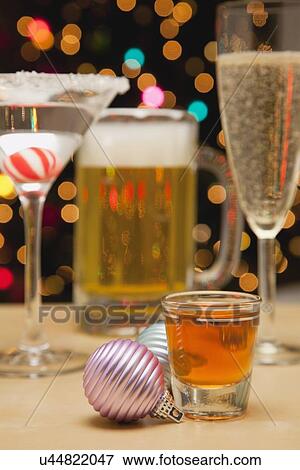 Stock Photo - USA, Illinois, Metamora, Various drinks and Christmas ornaments. Fotosearch