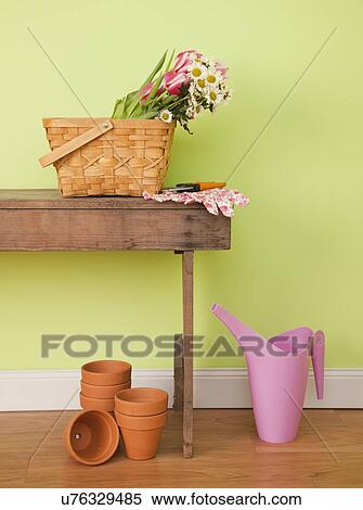 Stock Photography - USA, Illinois, Metamora, Wildflowers in basket on table. Fotosearch