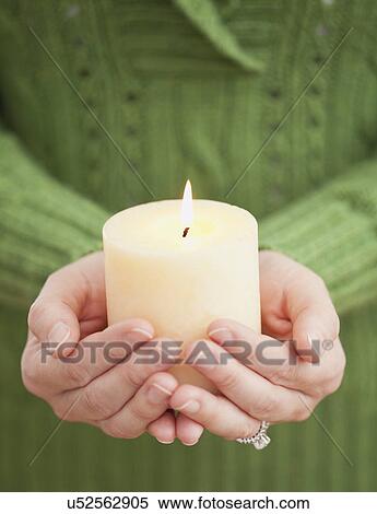 USA, Illinois, Metamora, Woman holding candle View Large Photo Image Stock Photography - USA, Illinois, Metamora, Woman holding candle. Fotosearch