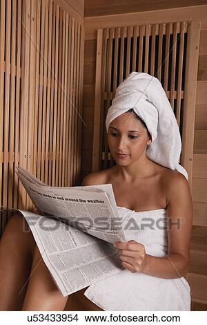 Picture - USA, Illinois, Metamora, woman relaxing in sauna. Fotosearch