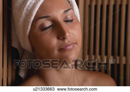 USA, Illinois, Metamora, woman relaxing in sauna View Large Photo Image Stock Image - USA, Illinois, Metamora, woman relaxing in sauna. Fotosearch