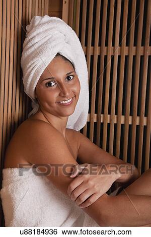 USA, Illinois, Metamora, woman relaxing in sauna View Large Photo Image Stock Photograph - USA, Illinois, Metamora, woman relaxing in sauna. Fotosearch