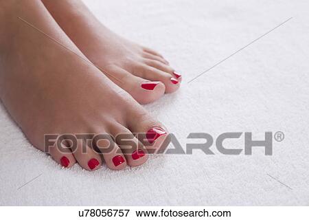 Stock Photo - USA, Illinois, Metamora, woman with red pedicure. Fotosearch