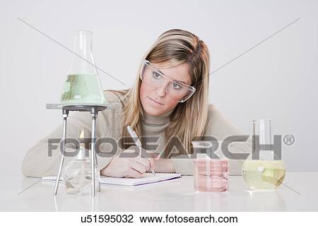 USA, Illinois, Metamora, woman working with laboratory glassware View Large Photo Image Stock Image - USA, Illinois, Metamora, woman working with laboratory glassware. Fotosearch