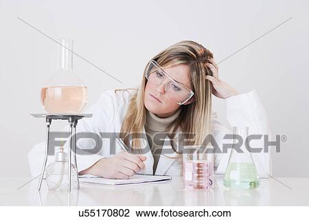 USA, Illinois, Metamora, woman working with laboratory glassware View Large Photo Image Stock Image - USA, Illinois, Metamora, woman working with laboratory glassware. Fotosearch