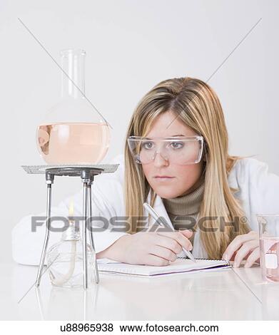 USA, Illinois, Metamora, woman working with laboratory glassware View Large Photo Image Stock Photo - USA, Illinois, Metamora, woman working with laboratory glassware. Fotosearch