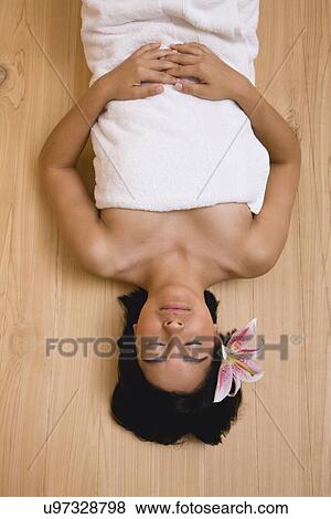 USA, Illinois, Metamora, Young woman relaxing in sauna View Large Photo Image Stock Photo - USA, Illinois, Metamora, Young woman relaxing in sauna. Fotosearch