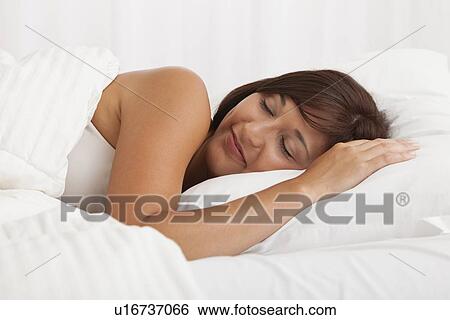 USA, Illinois, Metamora, young woman sleeping in bed View Large Photo Image Stock Photograph - USA, Illinois, Metamora, young woman sleeping in bed. Fotosearch
