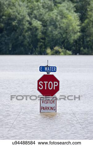 USA, Illinois, Stop sign in flood View Large Photo Image Picture - USA, Illinois, Stop sign in flood. Fotosearch