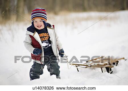 USA, Illinois, Washington, Boy (2-3) pulling sledge on snow View Large Photo Image Stock Photograph - USA, Illinois, Washington, Boy (2-3) pulling sledge on snow. Fotosearch