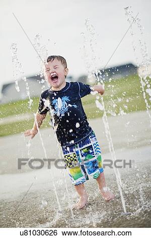 USA, Illinois, Washington, Boy (2-3) playing in fountain View Large Photo Image Stock Photograph - USA, Illinois, Washington, Boy (2-3) playing in fountain. Fotosearch