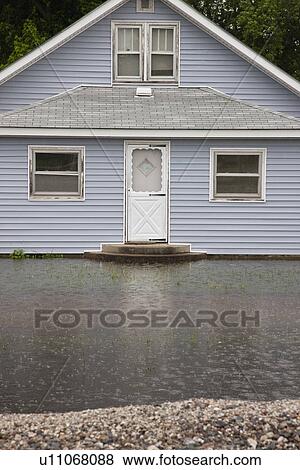 USA, Missouri, Cottage house in flood View Large Photo Image Stock Photo - USA, Missouri, Cottage house in flood. Fotosearch