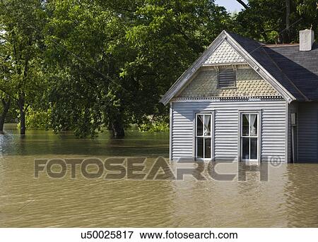 USA, Missouri, Cottage house in flood View Large Photo Image Stock Photo - USA, Missouri, Cottage house in flood. Fotosearch