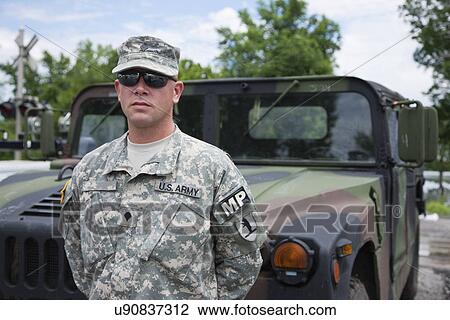 USA, Missouri, Portrait of US soldier standing in front of hummer View Large Photo Image Stock Image - USA, Missouri, Portrait of US soldier standing in front of hummer . Fotosearch