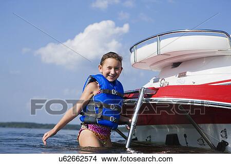 USA, Missouri, Stockton, Stockton Lake, girl (8-9) wearing lifejacket on boat View Large Photo Image Picture - USA, Missouri, Stockton, Stockton Lake, girl (8-9) wearing lifejacket on boat. Fotosearch
