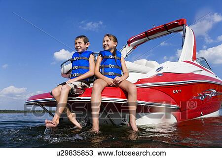 USA, Missouri, Stockton, Stockton Lake, boy (6-7) and girl (8-9) sitting on boat View Large Photo Image Stock Image - USA, Missouri, Stockton, Stockton Lake, boy (6-7) and girl (8-9) sitting on boat. Fotosearch