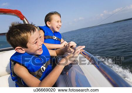 USA, Missouri, Stockton, Stockton Lake, boy (6-7) and girl (8-9) riding in boat View Large Photo Image Stock Image - USA, Missouri, Stockton, Stockton Lake, boy (6-7) and girl (8-9) riding in boat. Fotosearch