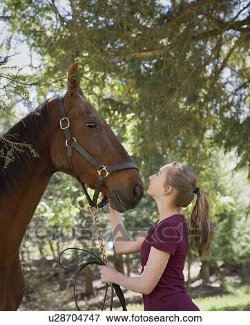 USA, New Jersey, Hardwick, Girl with horse at farm View Large Photo Image Stock Photo - USA, New Jersey, Hardwick, Girl with horse at farm. Fotosearch