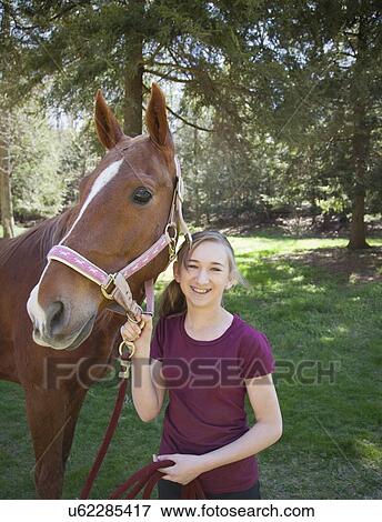 USA, New Jersey, Hardwick, Girl with horse at farm View Large Photo Image Stock Photo - USA, New Jersey, Hardwick, Girl with horse at farm. Fotosearch
