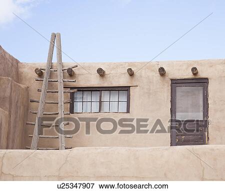 USA, New Mexico, Stone house exterior with ladder View Large Photo Image Stock Photo - USA, New Mexico, Stone house exterior with ladder. Fotosearch