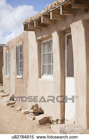 Stock Photography - USA, New Mexico, Stone houses in desert. Fotosearch