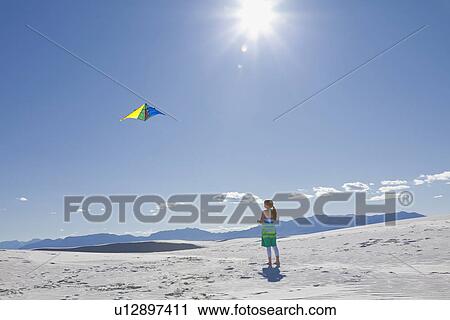 USA, New Mexico, Whitesands, Girl (10-11) flying kite on desert View Large Photo Image Stock Image - USA, New Mexico, Whitesands, Girl (10-11) flying kite on desert. Fotosearch