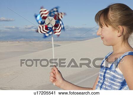 USA, New Mexico, Whitesands, Girl (10-11) on desert holding pinwheel View Large Photo Image Stock Image - USA, New Mexico, Whitesands, Girl (10-11) on desert holding pinwheel. Fotosearch
