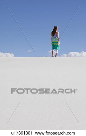 USA, New Mexico, Whitesands, Girl (10-11) standing on desert, low angle view View Large Photo Image Stock Image - USA, New Mexico, Whitesands, Girl (10-11) standing on desert, low angle view. Fotosearch