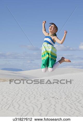 USA, New Mexico, Whitesands, Girl (10-11) jumping on desert View Large Photo Image Stock Image - USA, New Mexico, Whitesands, Girl (10-11) jumping on desert. Fotosearch