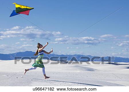 USA, New Mexico, Whitesands, girl (10-11) flying kite on desert View Large Photo Image Stock Image - USA, New Mexico, Whitesands, girl (10-11) flying kite on desert. Fotosearch