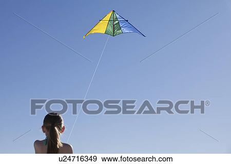 USA, New Mexico, Whitesands, Girl (10-11) flying kite View Large Photo Image Stock Photo - USA, New Mexico, Whitesands, Girl (10-11) flying kite. Fotosearch