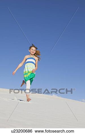 USA, New Mexico, Whitesands, Girl (10-11) running on desert View Large Photo Image Stock Photograph - USA, New Mexico, Whitesands, Girl (10-11) running on desert. Fotosearch