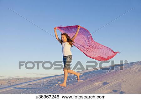 USA, New Mexico, Whitesands, Girl (1-11) running on desert with scarf View Large Photo Image Stock Photograph - USA, New Mexico, Whitesands, Girl (1-11) running on desert with scarf. Fotosearch