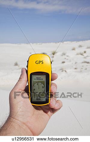 USA, New Mexico, Whitesands, Hand holding GPS device View Large Photo Image Stock Image - USA, New Mexico, Whitesands, Hand holding GPS device. Fotosearch