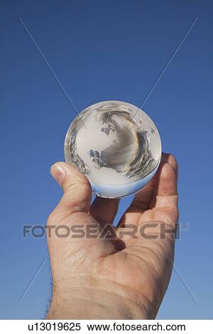 USA, New Mexico, Whitesands, Hand holding glass ball View Large Photo Image Stock Photography - USA, New Mexico, Whitesands, Hand holding glass ball. Fotosearch