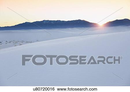 Stock Photograph - USA, New Mexico, Whitesands, Sunrise on desert. Fotosearch