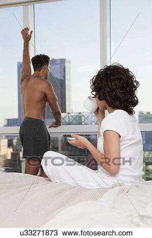 USA, New York City, couple drinking morning coffee in bedroom View Large Photo Image Stock Image - USA, New York City, couple drinking morning coffee in bedroom. Fotosearch