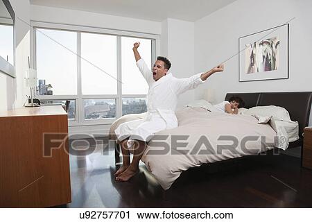 USA, New York City, man stretching in bedroom View Large Photo Image Stock Image - USA, New York City, man stretching in bedroom. Fotosearch
