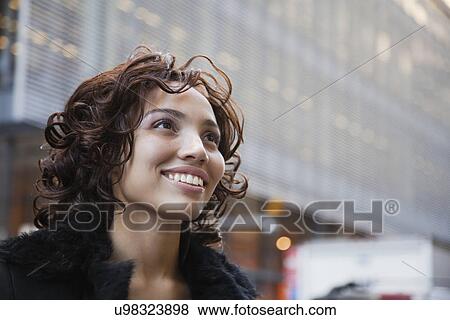 USA, New York, New York City, portrait of smiling woman on street View Large Photo Image Stock Photo - USA, New York, New York City, portrait of smiling woman on street. Fotosearch