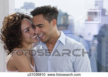 USA, New York State, New York City, young couple embracing by window View Large Photo Image Stock Image - USA, New York State, New York City, young couple embracing by window. Fotosearch
