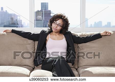 USA, New York State, New York City, business woman relaxing on sofa View Large Photo Image Stock Image - USA, New York State, New York City, business woman relaxing on sofa. Fotosearch