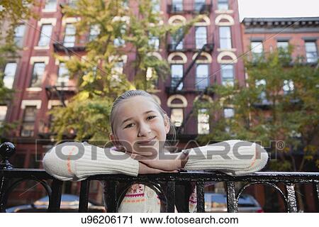 USA, New York State, New York City, Portrait of smiling girl (10-11), buildings in background View Large Photo Image Stock Image - USA, New York State, New York City, Portrait of smiling girl (10-11), buildings in background. Fotosearch