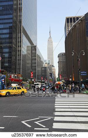 Stock Photo - USA, New York State, New York City, pedestrians crossing street. Fotosearch