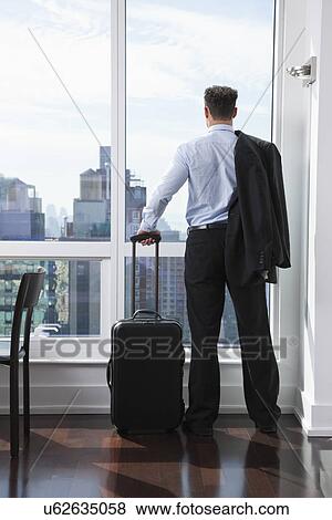 USA, New York State, New York City, business man looking through window View Large Photo Image Stock Photo - USA, New York State, New York City, business man looking through window. Fotosearch
