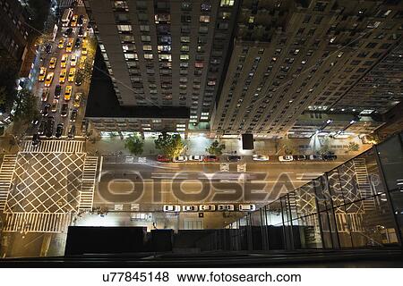 USA, New York State, New York City, Manhattan, illuminated street View Large Photo Image Stock Photo - USA, New York State, New York City, Manhattan, illuminated street. Fotosearch