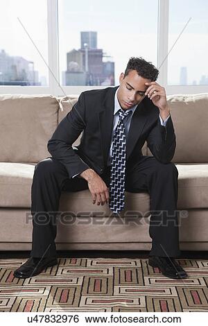 USA, New York State, New York City, frustrated business man sitting on sofa View Large Photo Image Stock Photograph - USA, New York State, New York City, frustrated business man sitting on sofa. Fotosearch