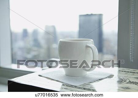 USA, New York State, New York City, Coffee cup on table, skyline in background View Large Photo Image Stock Photography - USA, New York State, New York City, Coffee cup on table, skyline in background. Fotosearch